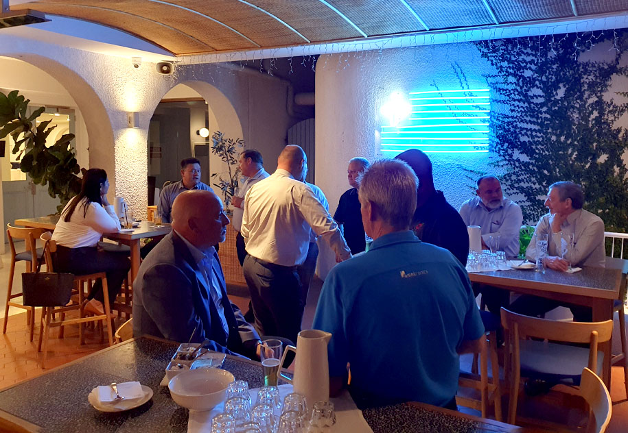 Group of people having a drink at The Greek Club at the Brisbane Sundowner event | April 2023