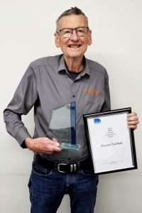 Wayne Turnbull with award and certificate of NSW State Industry Professional of the Year for 2023